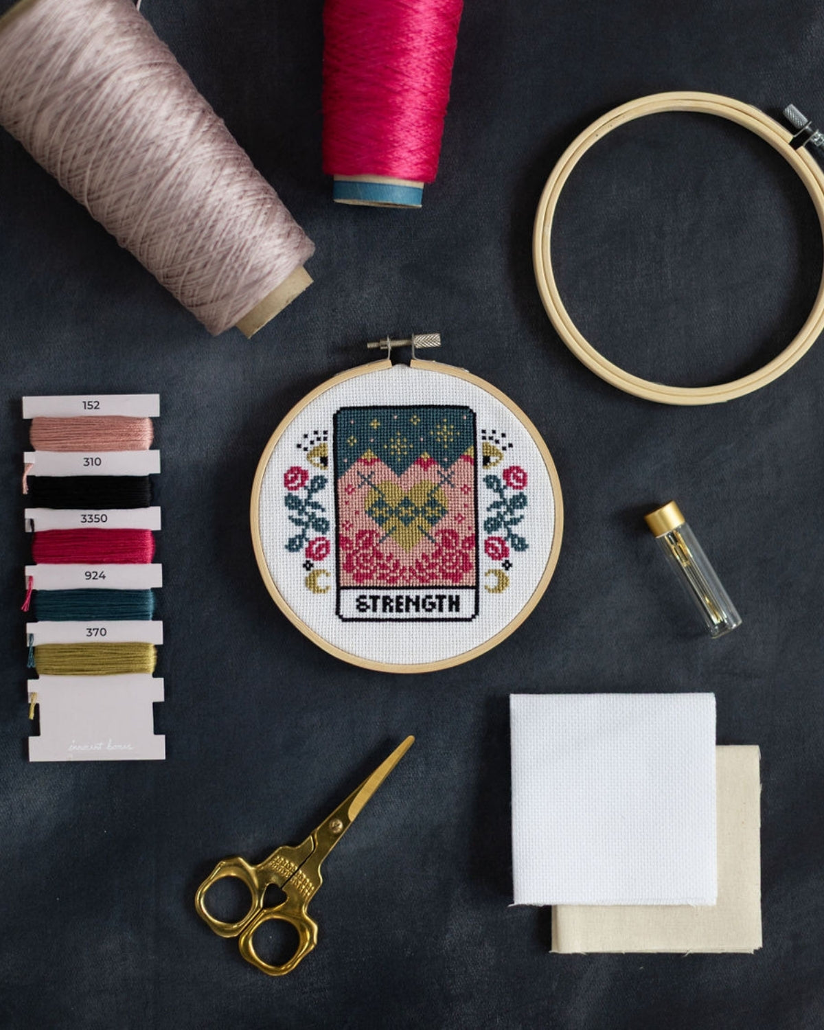 strength tarot cross stitch design with accessories