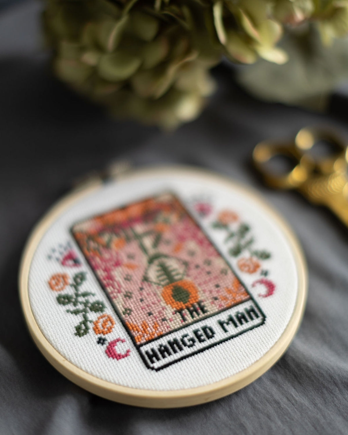 The hanged man tarot cross stitch design close up